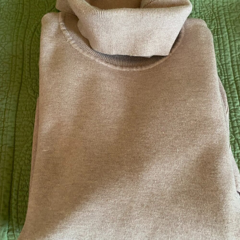 Nearly new cream color, long comfortable sweater with pockets and slits.